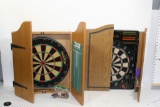 Lot of Dart Boards in Wooden Cabinets with accessories included. 2 units