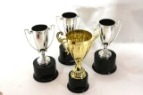 Trophy Collection Gold & Silver Colored with wooden base approx size 10-12 inches. 4 units