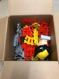 Box Full Of Plastic Train Tracks Toys