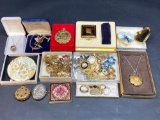 Collection of costume jewelry, compacts, earrings, pins, bracelet, necklaces, rings