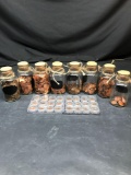 Cork atop Jars With Pennies 8 Units