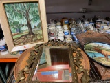 Shelf contents paintings trays mirror and famous songs