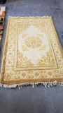 75in x 48in Gold Colored Rug