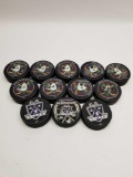 Anaheim Ducks LA Kings Hockey Pucks Signed 12 Units