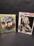 Elvis world book and Marilyn Monroe puzzle.