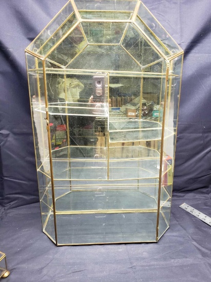 Glass wall curio cabinet 25 x 15. Mirrored back for reflective display.