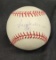 Autographed baseball says Reggie Jackson