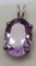 Purple Tanzanite stone set in silver pendant