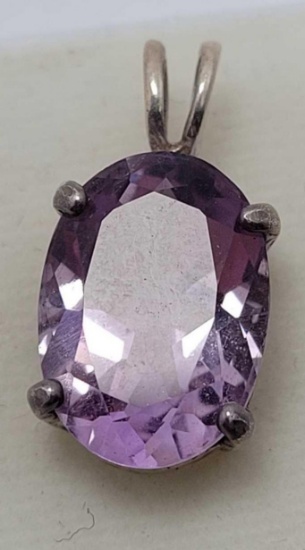 Purple Tanzanite stone set in silver pendant