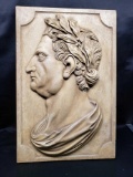 Julius Caesar profile carved in wood.