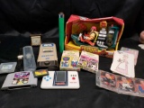 Mixed lot. Watches. Rescue heros action figure. Hand held games. Untested.