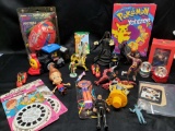 Mixed lot of toys. View master reels. Pokemon Yahtzee jr. Dan Marino toy football. Batman and Robin