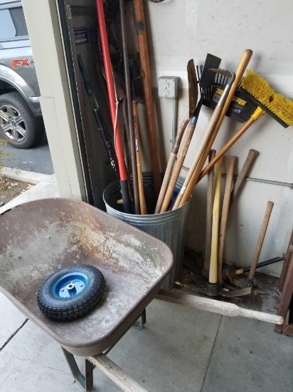 Trash Bin Full of Gardening Tools Wheelbarrow