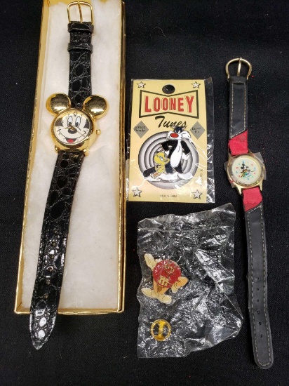 Mickey Mouse watches Lioney tunes pin and M an M pin