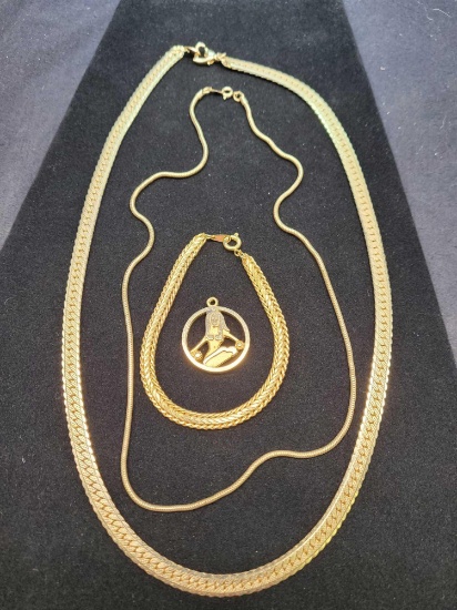 2 necklaces 1 bracelet and a pendant