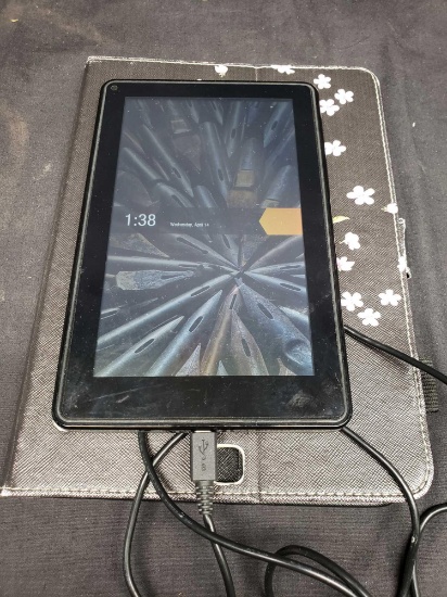Amazon Fire Kindle HD 6. 8 gig and Logitech Tablet Speaker. Turns on.