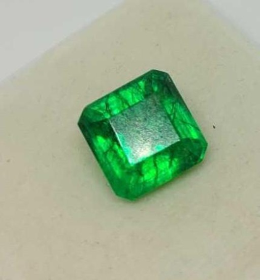 Emerald glowing green color with gem ID card square cut