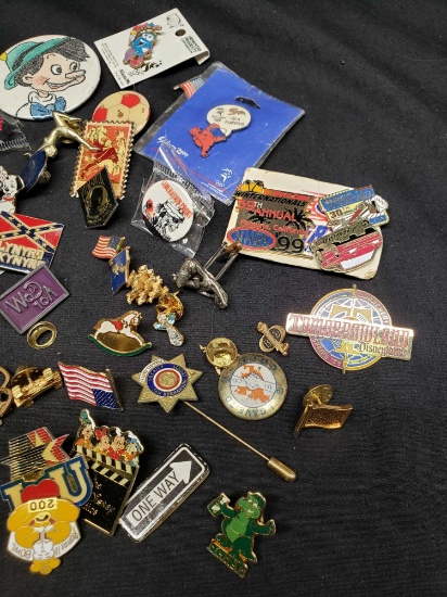 Hat pins. Flags Lynyrd Skynyrd, Pow. Tomorrowland, Ucla and more.