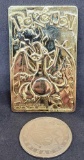 Gold plated Charizard pokemon card and Pikachu coin
