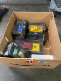 Box of die cast Ford and chewy model cars
