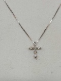 14kt white gold and diamond cross necklace
