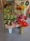 Green Wrought iron flower pot stand with flowers