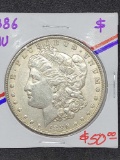 1886 Morgan silver dollar Au