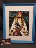 Framed photo of Johnny Depp as Captain Jack Sparrow. Signed