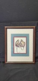Framed artwork of two chimpanzees with signature