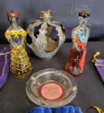 Crown Royal bags, metal crown, Madonna Inn ashtray, Mexican glass figures.