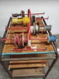 Two hand caddys for wire spools with wire