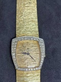 Baume and Mercier 14kt gold and diamond watch