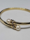 Stunning bracelet 14kt gold band with set Diamonds and pearls.