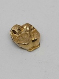 18kt gold tooth