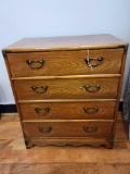 Small Four drawer wood chest w brass embellishing