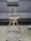 Craftsman rotating stool with paded seat and back.