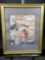 Framed art with signature.