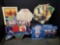 4 metal beer signs and 1 stop sign.