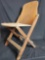 Vintage wooden fold up chair. says America Seating