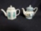 2 small teapots.
