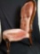 Vintage wood frame and upholstery chair with wheels
