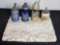 4 stien mugs. Floral design tablecloth.