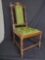 Vintage wood frame chair with green floral upholstery seat & back.