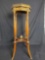 Vintage wooden Stand with metal rim.