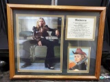 Framed Madonna pictures with biography info and album names wit dates.