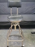 Craftsman rotating stool with paded seat and back.
