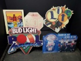 4 metal beer signs and 1 stop sign.