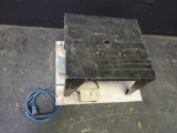 Small work bench with power outlet and off/on switch.