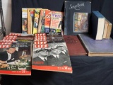 Box of vintage magazines and books.
