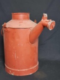 Vintage metal gas/water tank with pouring spout.